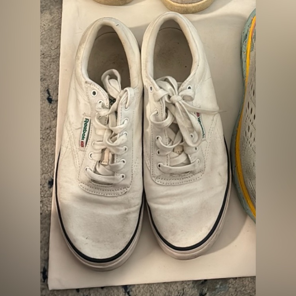 White canvas Reebok sneakers